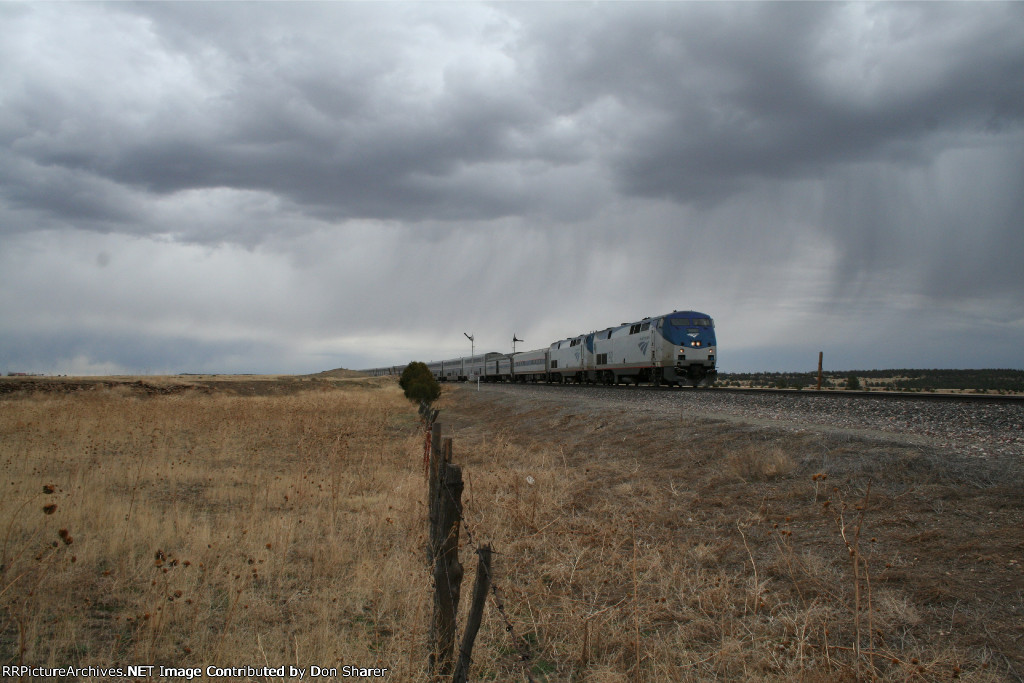 Amtrak #3, The Southwest Chief, splits the semaphores on a stormy day